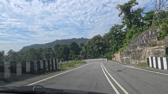 23.10.2025.Bagrakote West Bengal India  4k video clip of a road trip in a car as seen from driver point of view on a bright sunny day in India
