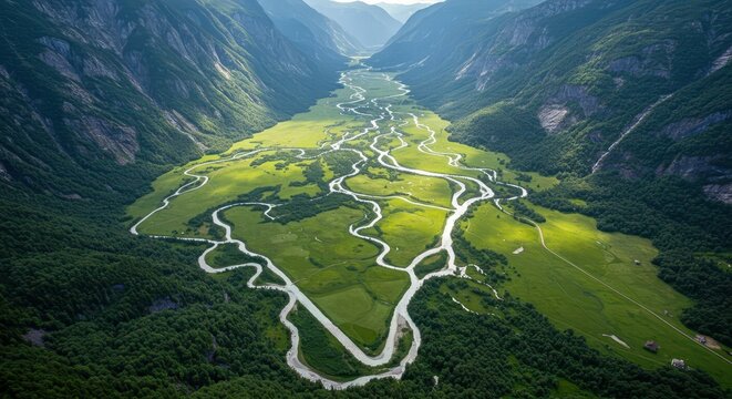 Elevated view captures serpentine river winding through a lush, steep-sided mountain valley