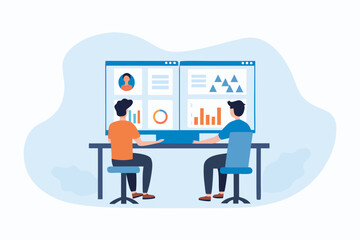 Two people collaborating at a desk analyzing data on a large computer screen with charts and graphs