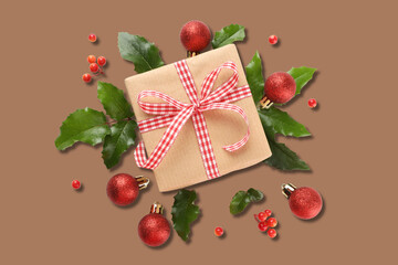 Gift box with ribbon among Christmas decor