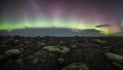 Naklejka premium Aurora Borealis over Icelandic Lava Field - A Night Spectacle.