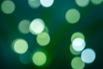Small round white bokeh on dark background – holiday abstract backdrop, front view