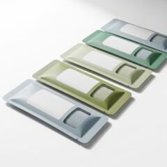 Colorful Adhesive Bandages Set in Green Blue Gray and White on White Background