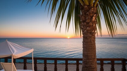 Tropical sunset on the beach with palm tree and turquoise sea