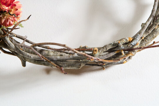 Detail of grapevine wreath, natural brown and grey intertwined branches, rustic craft base