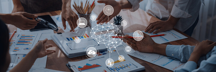 Dynamic business meeting illustrating teamwork and innovative thinking. Participants engage with data and technology to enhance collaboration and drive strategic goals. Trope