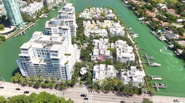 Miami Beach, Florida USA, Drone Shot of Bridge Traffic Buildings and Homes on Allison and La Gorce Islands, Indian Creek