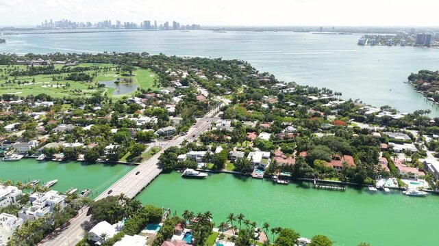 Drone Shot of La Gorce Island and Neighborhood of Miami Beach, Florida USA, Upscale Homes, Traffic, Indian Creek and Biscayne Bay