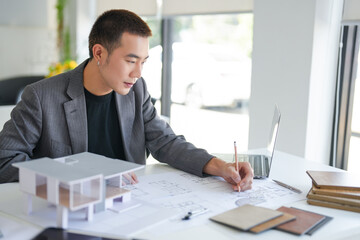 Architecture Man drawing on architectural Creative project business architecture building...