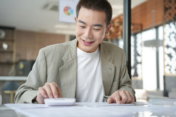 Confident asian business man Auditor or internal revenue service staff checking annual financial...