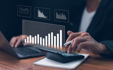 Analyzing digital business data, financial growth, and market strategy using futuristic charts and graphs displayed on a laptop screen. Concepts of technology and investment.