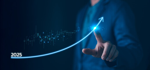 Driving business growth for 2025. Hand touches a glowing arrow symbolizing exponential investment success, financial strategy, and future economic performance visualized on a digital chart.