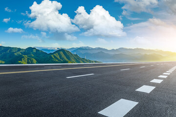 Fototapeta premium Asphalt highway road and mountain with beautiful sky clouds natural landscape at sunset