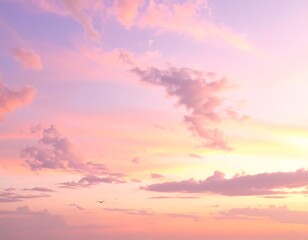 Obraz premium Pink and purple pastel-hued sky with scattered clouds; serene atmosphere