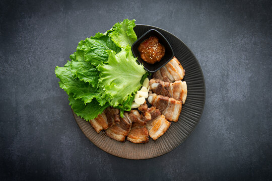 Authentic Korean Bossam Platter with Fresh Lettuce and Ssamjang