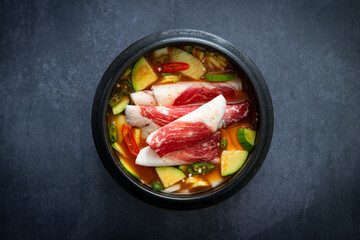 Savory Korean Pork Belly and Zucchini Stew (Jjigae) in a Stone Pot