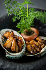 Gourmet Abalone Delicacy Served in a Black Pot