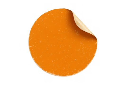 Round orange sticker with peeled corner showing adhesive backing, blank circular label, old paper texture, transparent background