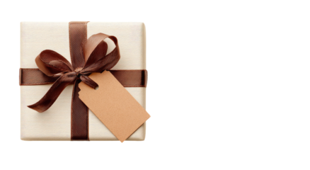 A square gift wrapped in cream paper with a dark brown satin bow and a tag