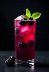 A deep purple blackberry mojito cocktail in a stylish glass, decorated with blackberries and mint leaves