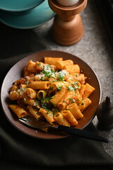 Rigatoni Pasta Dish.
A close-up photo of a rigatoni pasta dish served on a plate. Perfect for food, restaurant, or culinary-themed projects.
