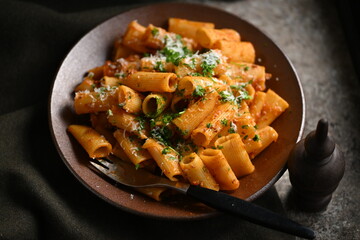 Rigatoni Pasta Dish.
A close-up photo of a rigatoni pasta dish served on a plate. Perfect for food, restaurant, or culinary-themed projects.
