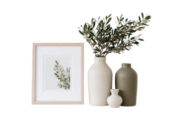 Still life arrangement of framed botanical print, vases, and olive branches