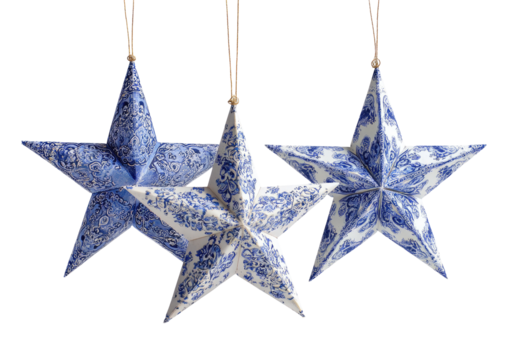 Three hanging stars with blue floral patterns on white porcelain, suspended by gold cords - Powered by Adobe