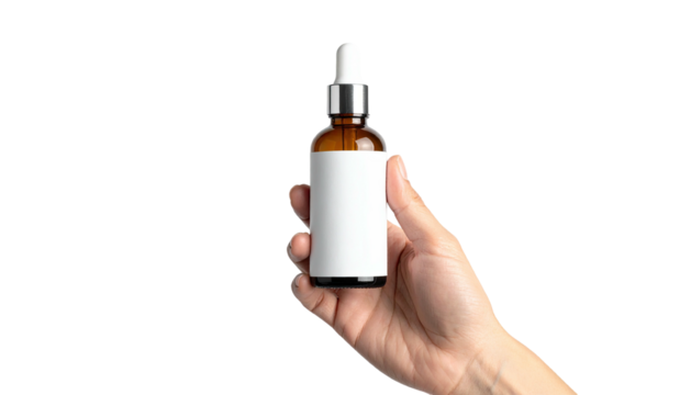 Hand holds amber glass dropper bottle; white label