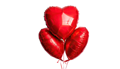 Three red, metallic heart-shaped balloons against black