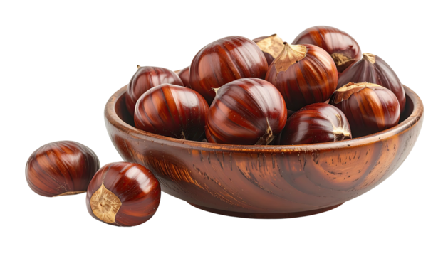 Shiny chestnuts fill a wooden bowl, one sits next to it