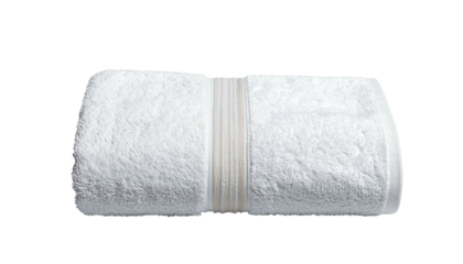 Rolled white towel with banded accent strip, dark backdrop