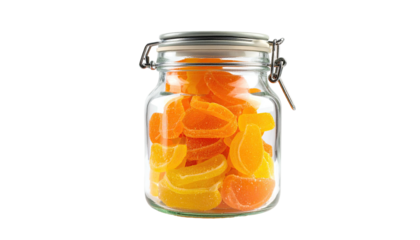 Orange jelly candies sit inside a clear, hinged glass jar