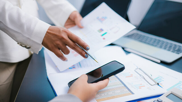 Business Team Analyzing Financial Data and Discussing Strategy