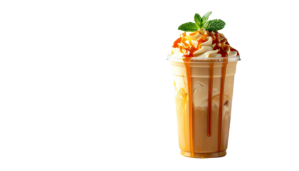 Iced caramel coffee topped with cream and mint on black backdrop