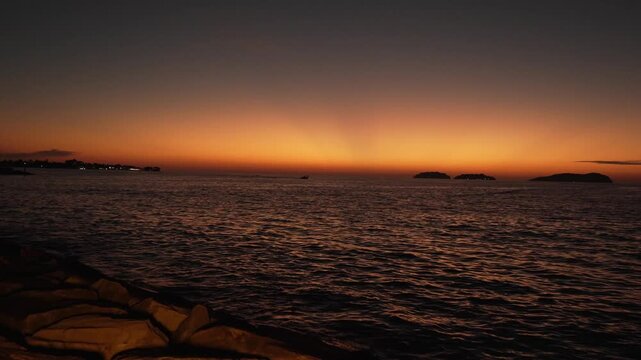 Beautiful stuning sunset,with nice city background,with boat and blue sea