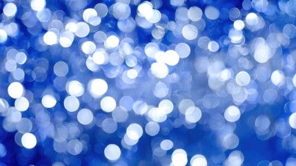 A vibrant blue backdrop filled with shimmering bokeh effects that catch the light beautifully.