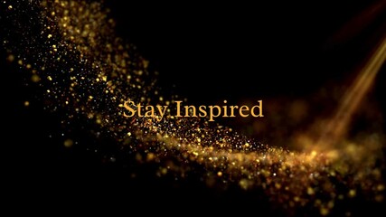 Golden "Stay Inspired" text amidst glittering particles and light on black, an elegant and motivational abstract background