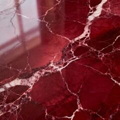 Closeup view of polished red marble with white veining, suitable for interior design projects, architectural presentations, or background textures.