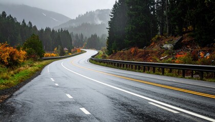Winding road cuts through mountain, fall colors emerge