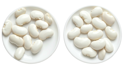 Two plates hold piles of creamy white lima beans