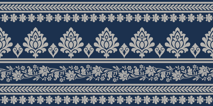 Floral ethnic pattern with elegant leaf and flower motifs in beige on dark blue background creating classic decorative design