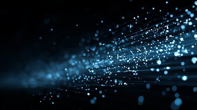 Dazzling blue light particles stream across a dark background, creating a sense of digital motion and technological advancement.