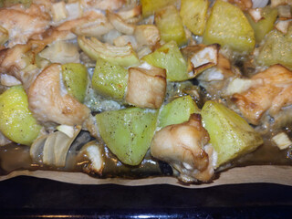 Tender pieces of chicken combined with zucchini chunks and onions, baked until golden. A hearty, home-cooked meal