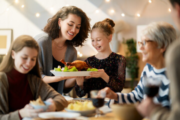 Family celebrating Thanksgiving Day
