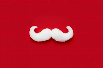 White moustache against a vibrant red background
