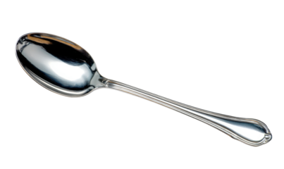 Close-up shot of a shiny, silver spoon with a long, elegant handle, isolated on white.