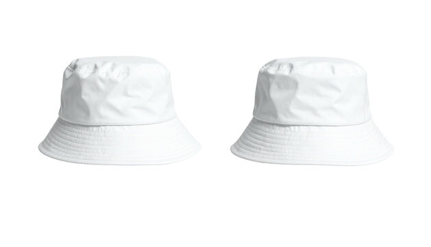 Two identical, solid white bucket hats against a black background