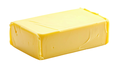 Block of yellow butter, rectangular and smooth on black