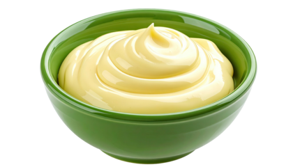 Glossy, swirled mayonnaise sits in a green ceramic bowl